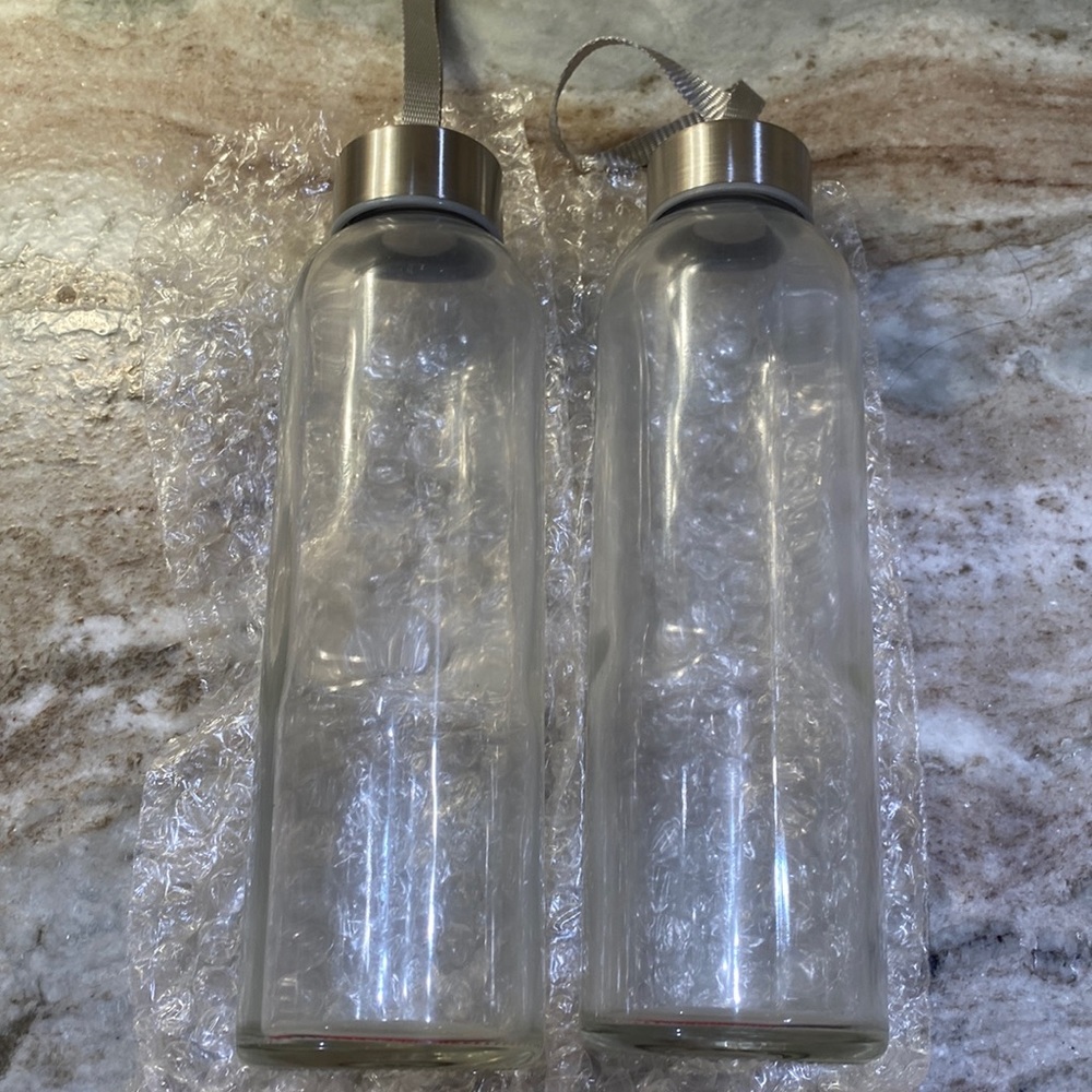Set of 2 glass water bottles.